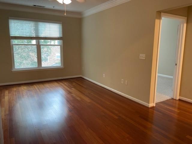 10 Perimeter Summit Boulevard, Unit 1310 Atlanta, GA 30319 - Photo 6 of 24 an empty room with wooden floor and windows
