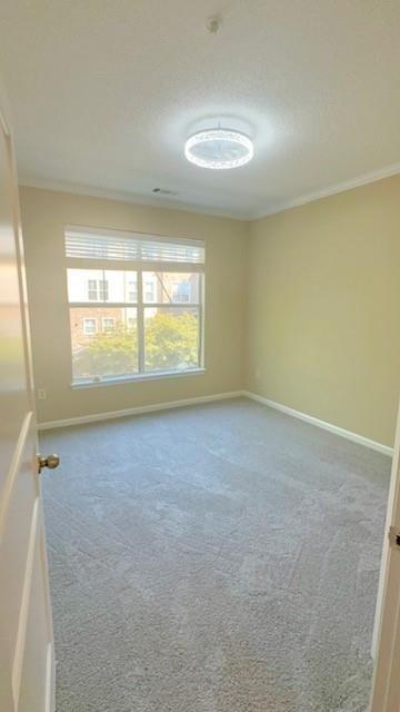 10 Perimeter Summit Boulevard, Unit 1310 Atlanta, GA 30319 - Photo 8 of 24 an empty room with a window