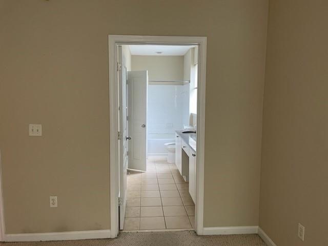 10 Perimeter Summit Boulevard, Unit 1310 Atlanta, GA 30319 - Photo 9 of 24 a view of a bathroom from a hallway