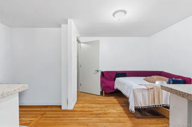 a kitchen with stainless steel appliances granite countertop a refrigerator a stove and a sink