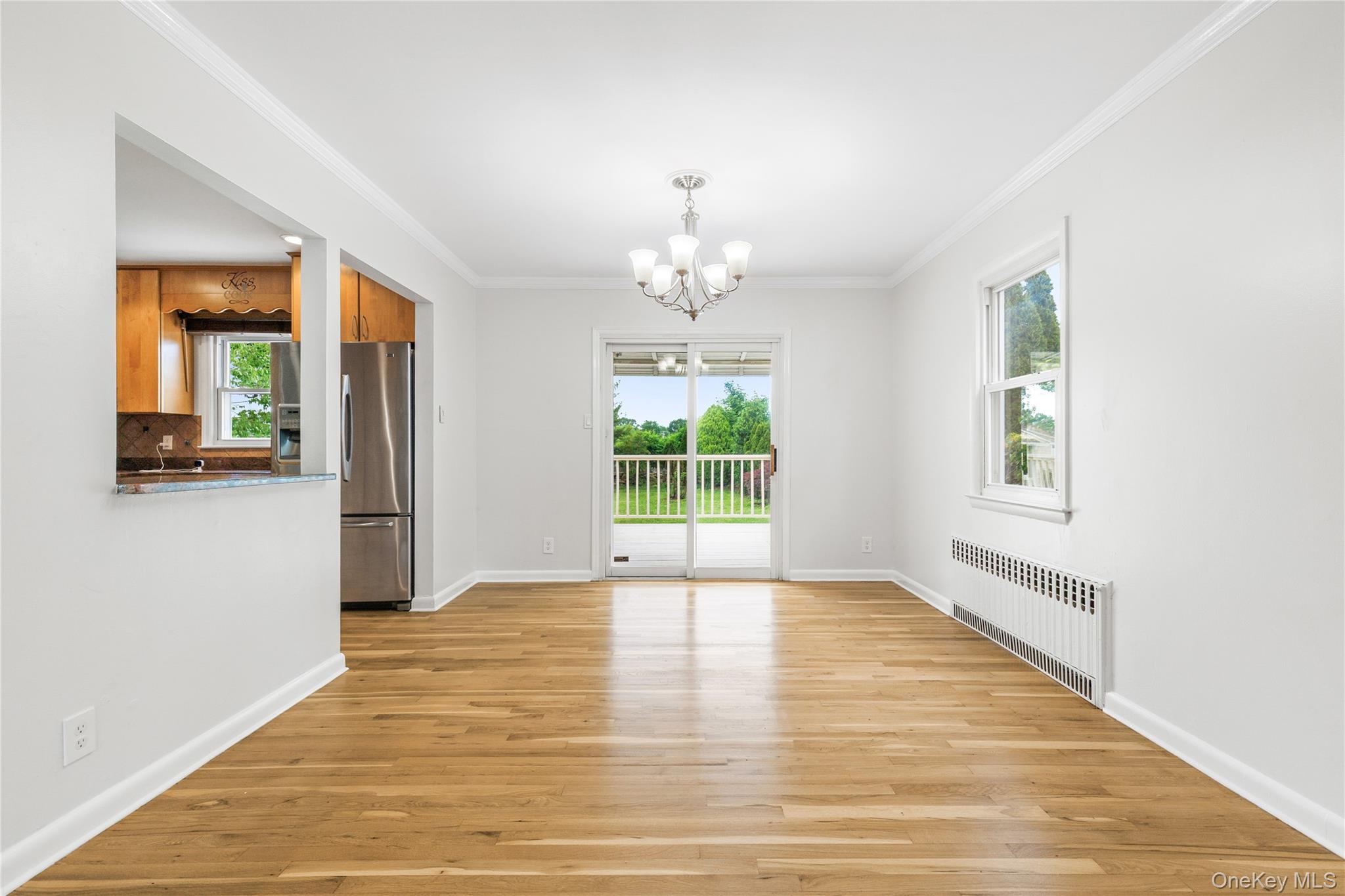 46 Mathews Street Harrison, NY 10528 - Photo 7 of 30 a view of an empty room with wooden floor and a window