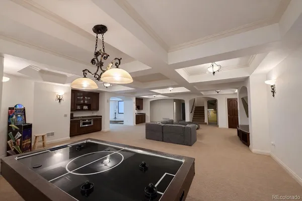 a kitchen with stainless steel appliances granite countertop a sink a stove and a refrigerator