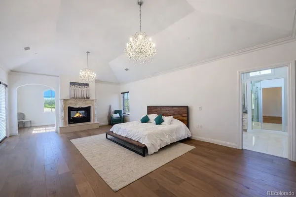 a bedroom with a bed and a fireplace