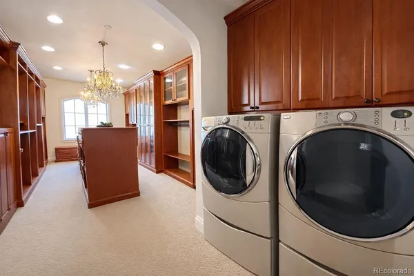 a view of a kitchen with washer and dryer