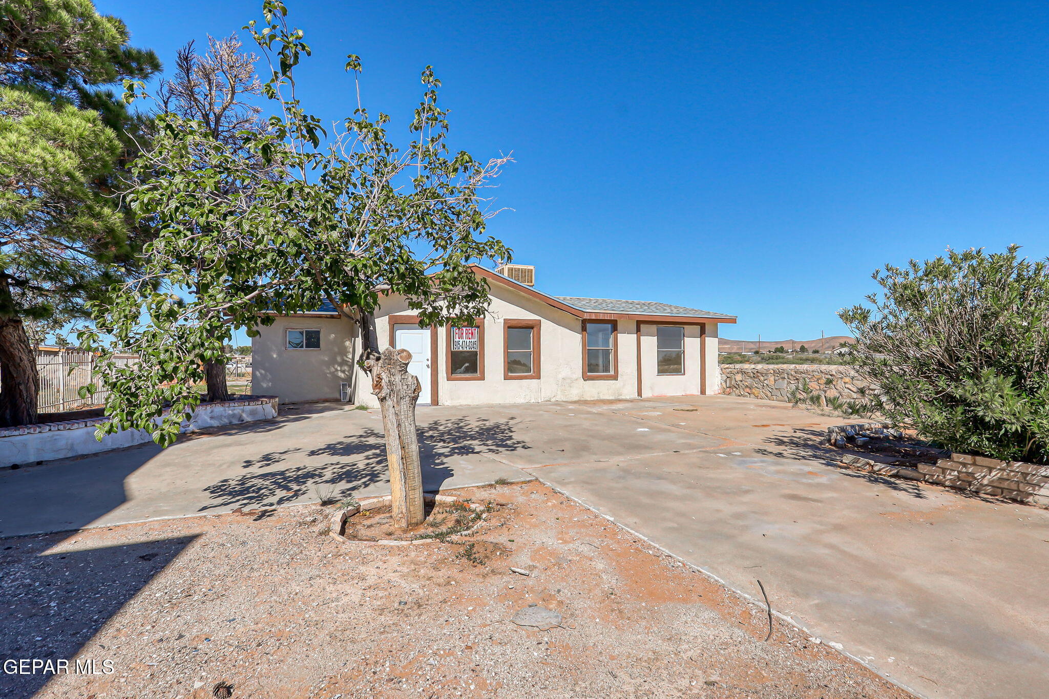 14573 B Van Fleet Road El Paso, TX 79938 - Photo 116 of 128 a front view of a house with a yard
