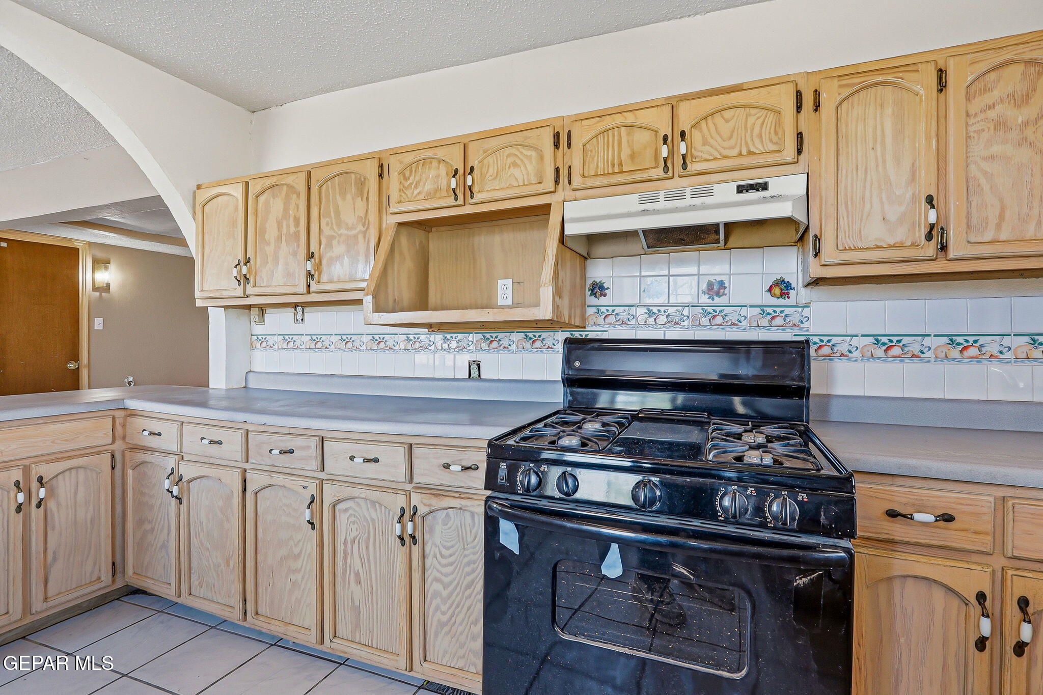 14573 B Van Fleet Road El Paso, TX 79938 - Photo 14 of 128 a kitchen with stainless steel appliances granite countertop a stove and a microwave