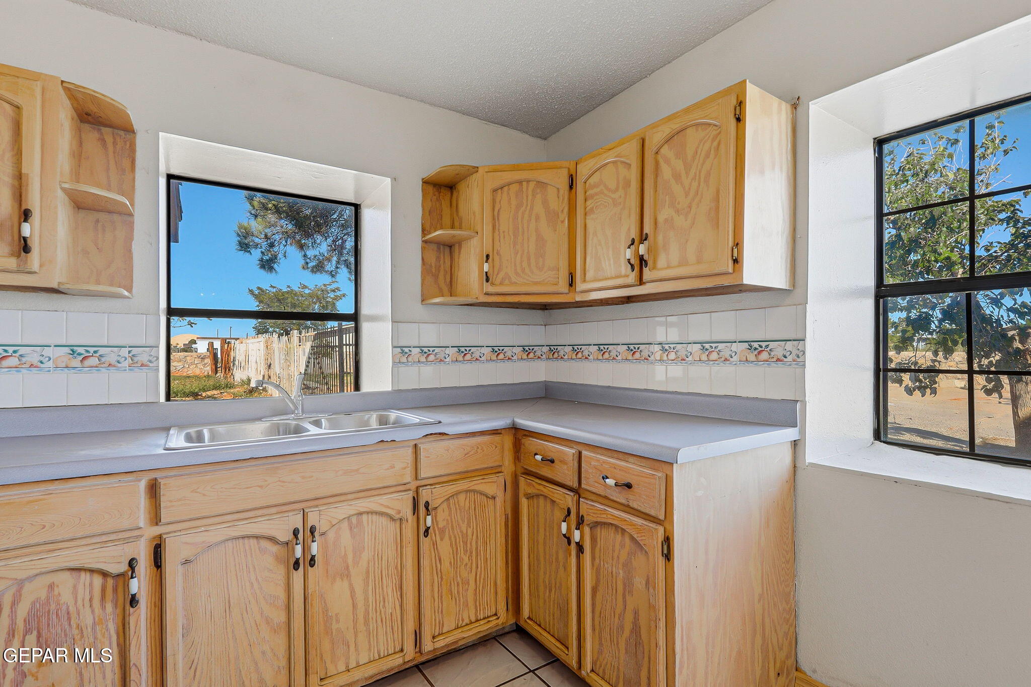 14573 B Van Fleet Road El Paso, TX 79938 - Photo 15 of 128 a kitchen with stainless steel appliances granite countertop a sink and cabinets