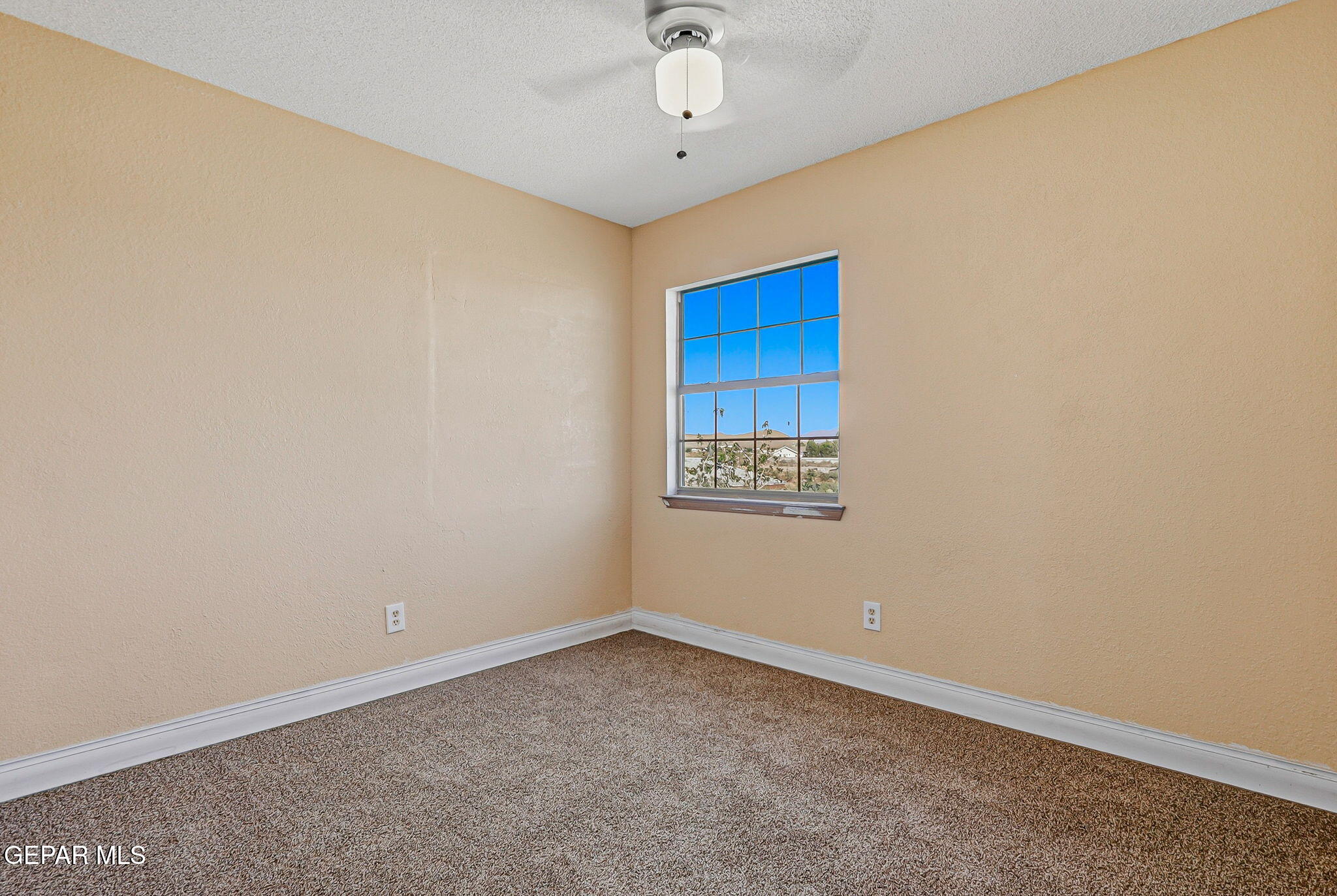 14573 B Van Fleet Road El Paso, TX 79938 - Photo 24 of 128 a view of an empty room with a window