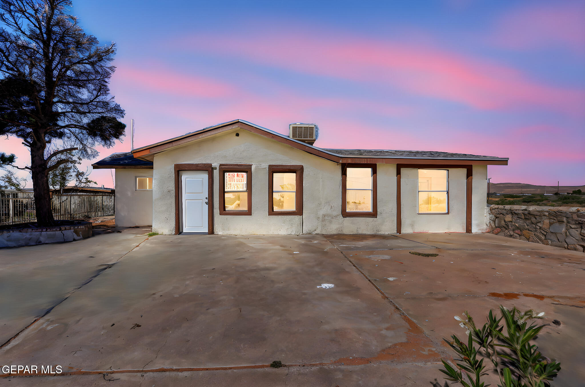 14573 B Van Fleet Road El Paso, TX 79938 - Photo 3 of 128 a front view of a house with a yard and garage