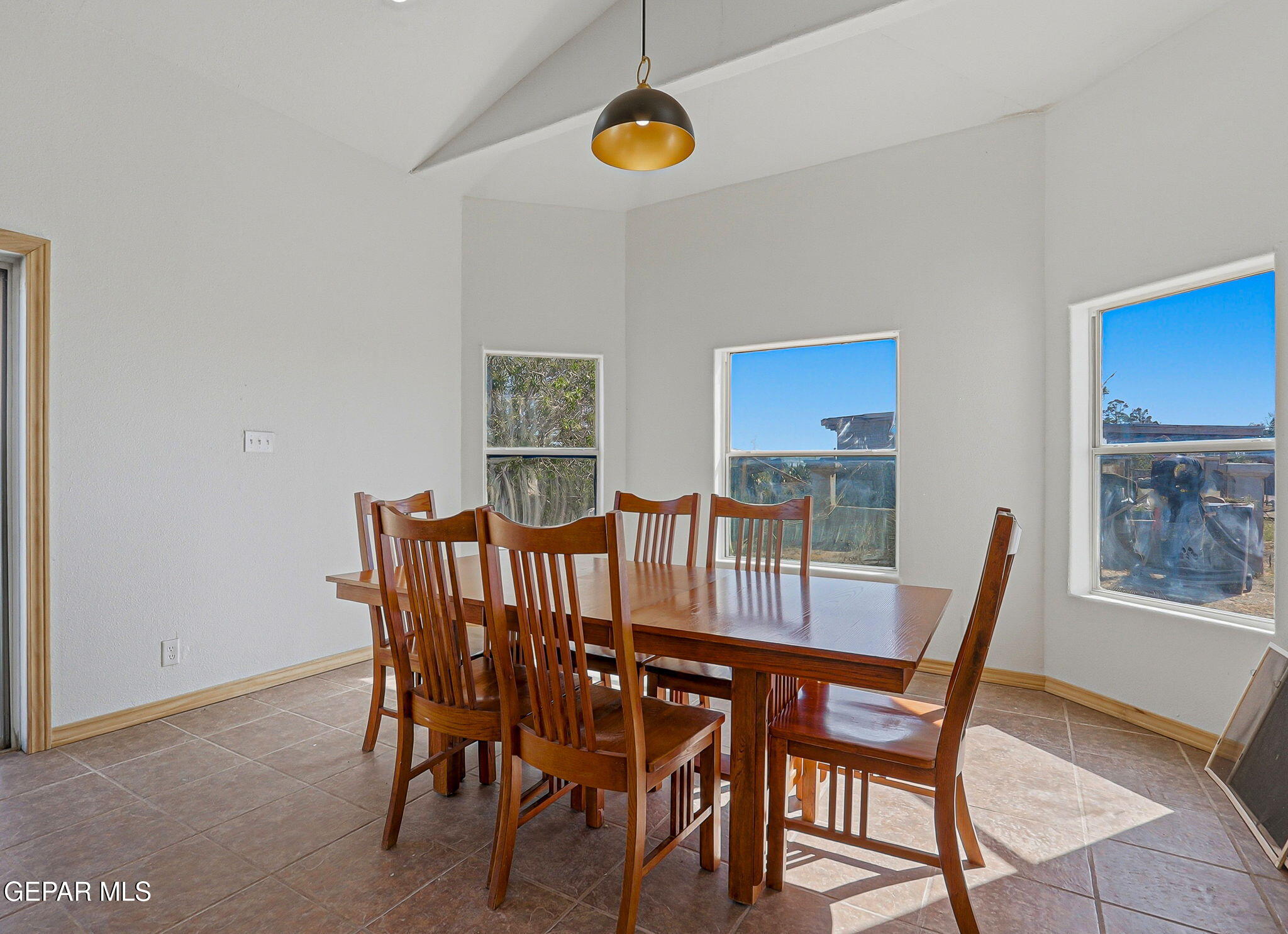 14573 B Van Fleet Road El Paso, TX 79938 - Photo 39 of 128 a view of a dining room and livingroom with furniture wooden floor and a rug