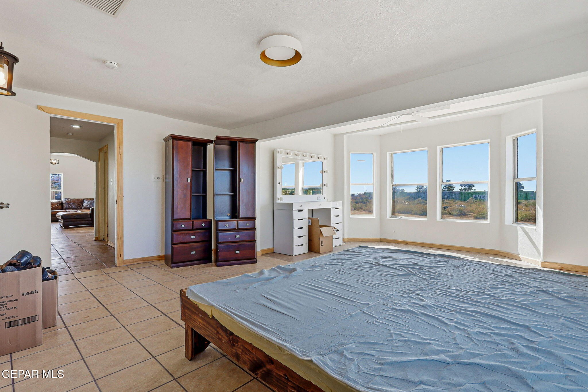 14573 B Van Fleet Road El Paso, TX 79938 - Photo 42 of 128 a room with gym equipment and large window