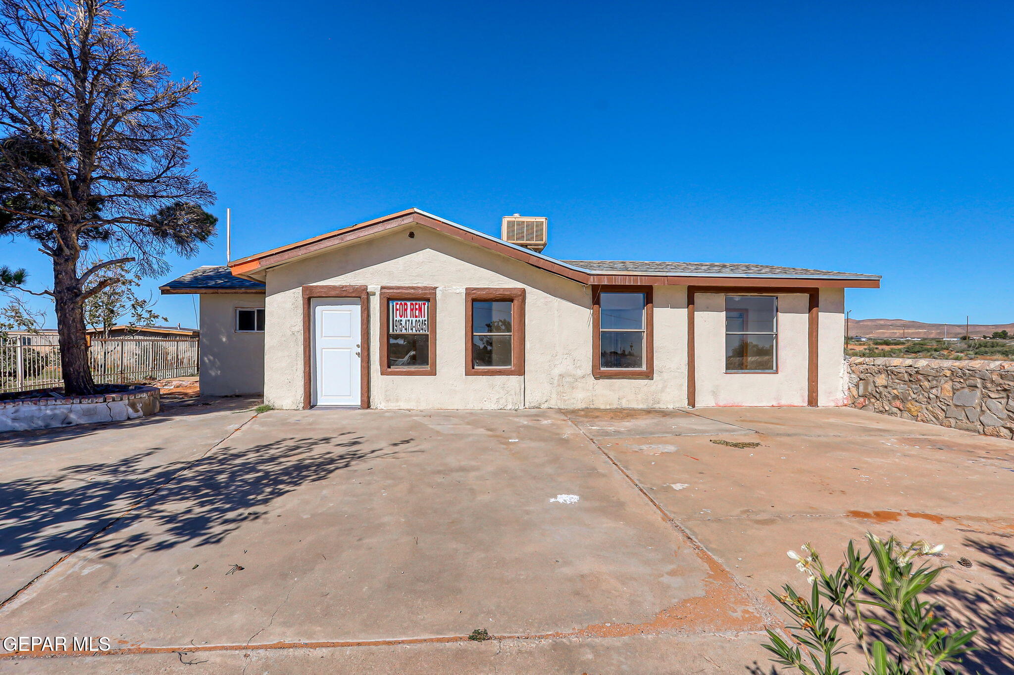 14573 B Van Fleet Road El Paso, TX 79938 - Photo 53 of 128 a front view of a house with a garden