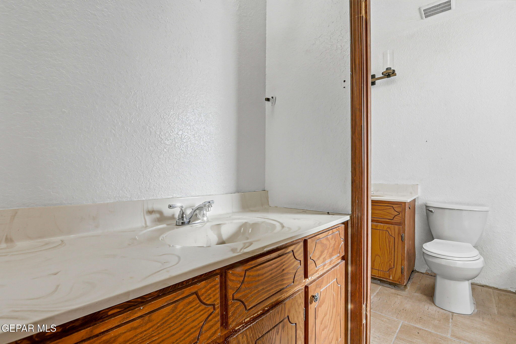 14573 B Van Fleet Road El Paso, TX 79938 - Photo 71 of 128 a bathroom with a sink a toilet and a mirror