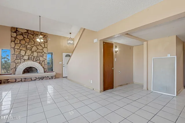 a kitchen with stainless steel appliances granite countertop a stove and a microwave