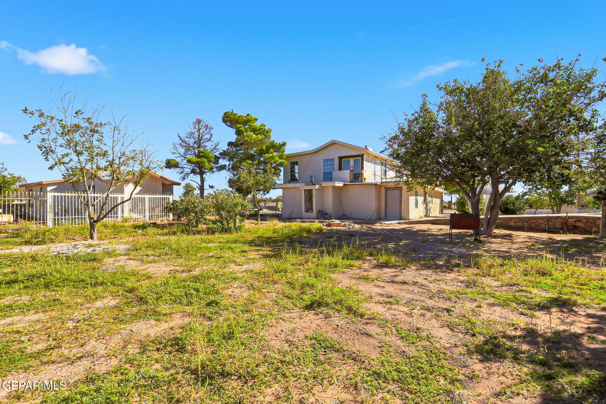 14573 B Van Fleet Road El Paso, TX 79938 - Photo 83 of 128 a house view with a swimming pool next to a yard