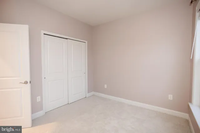 a view of a swimming pool and front of house