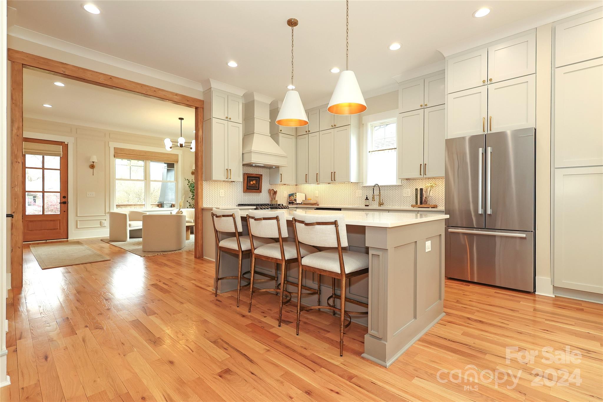 1300 Cortland Road West Charlotte, NC 28209 - Photo 15 of 48 a kitchen with stainless steel appliances kitchen island granite countertop a refrigerator a oven a sink and a dining table with wooden floor