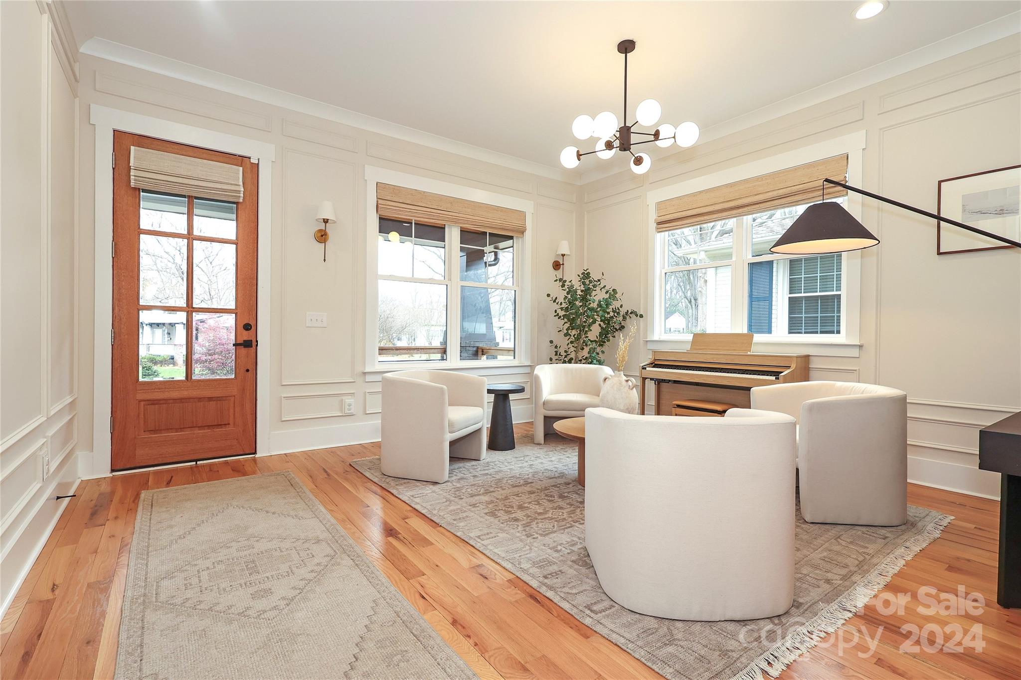 1300 Cortland Road West Charlotte, NC 28209 - Photo 3 of 48 a living room with furniture a chandelier and a dining table