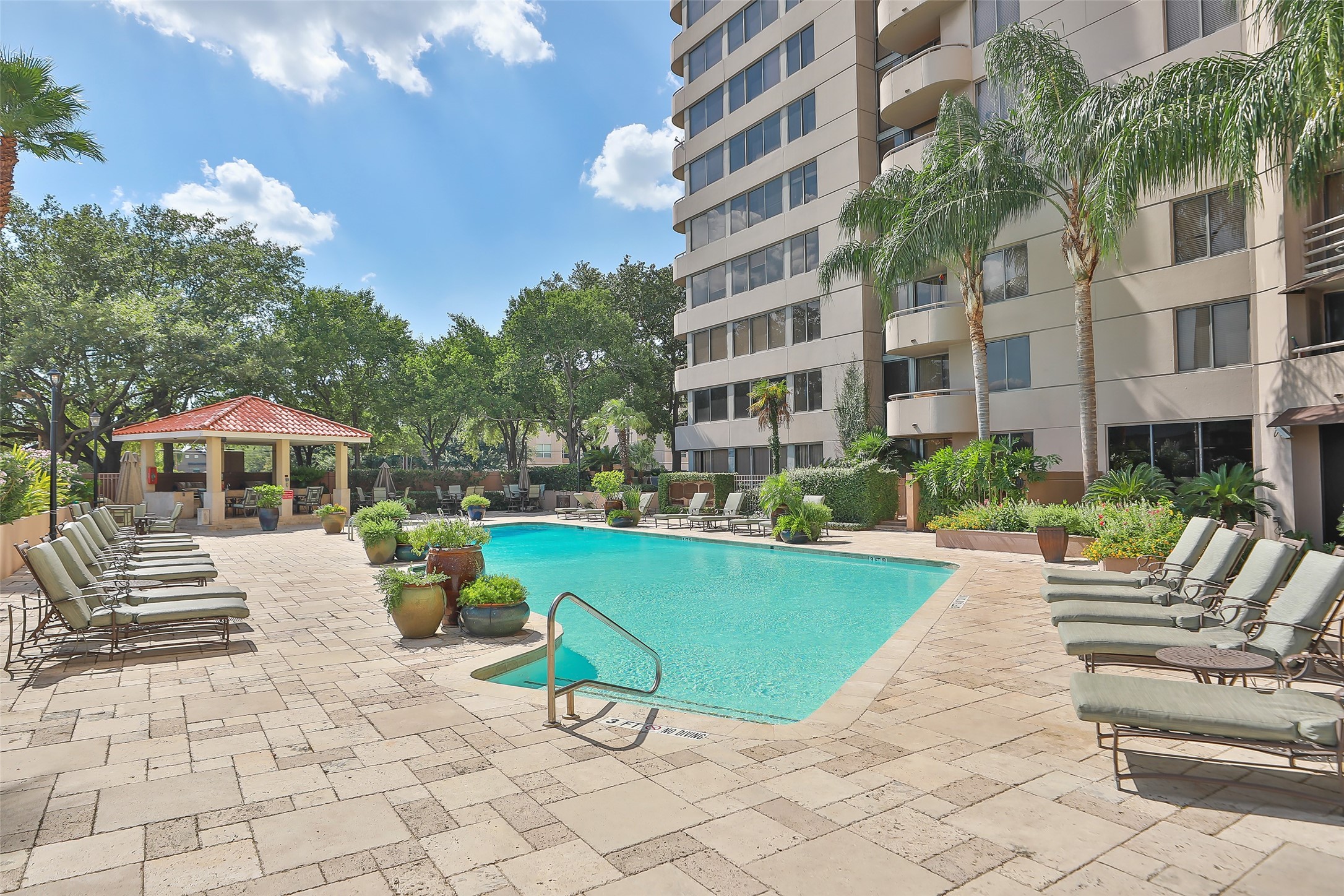 3525 Sage Road, Unit 1111 Houston, TX 77056 - Photo 8 of 19 a view of a swimming pool with a patio