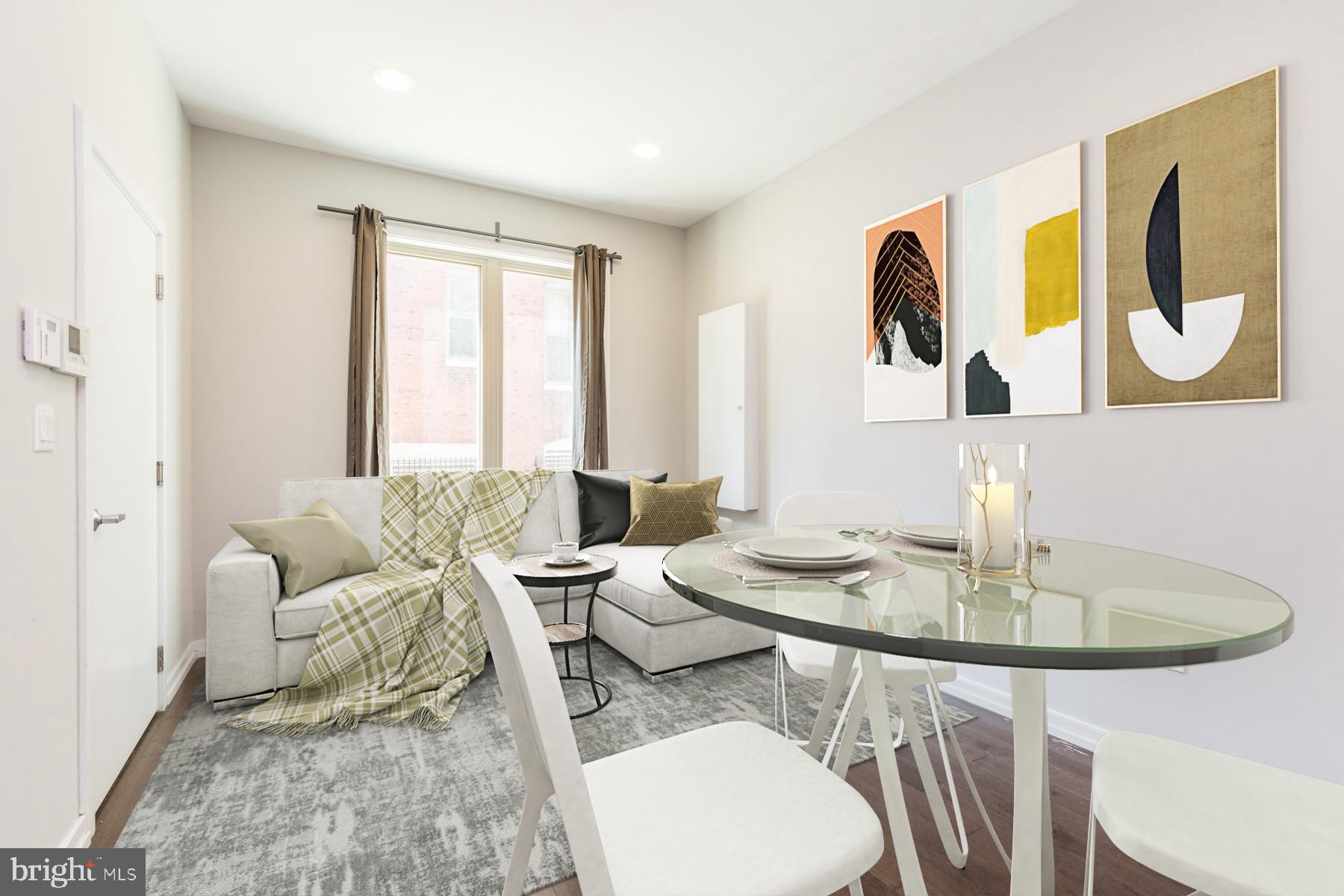 a living room with furniture and a table