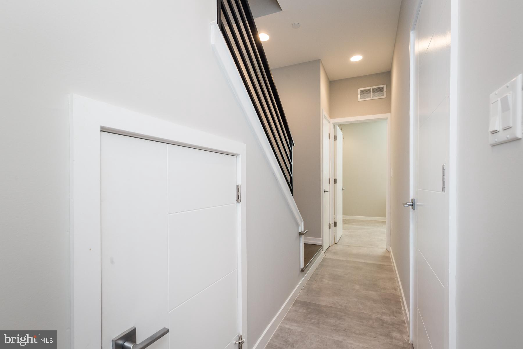 1815 Ranstead Street, Unit 1 Philadelphia, PA 19103 - Photo 13 of 27 a view of a hallway with staircase