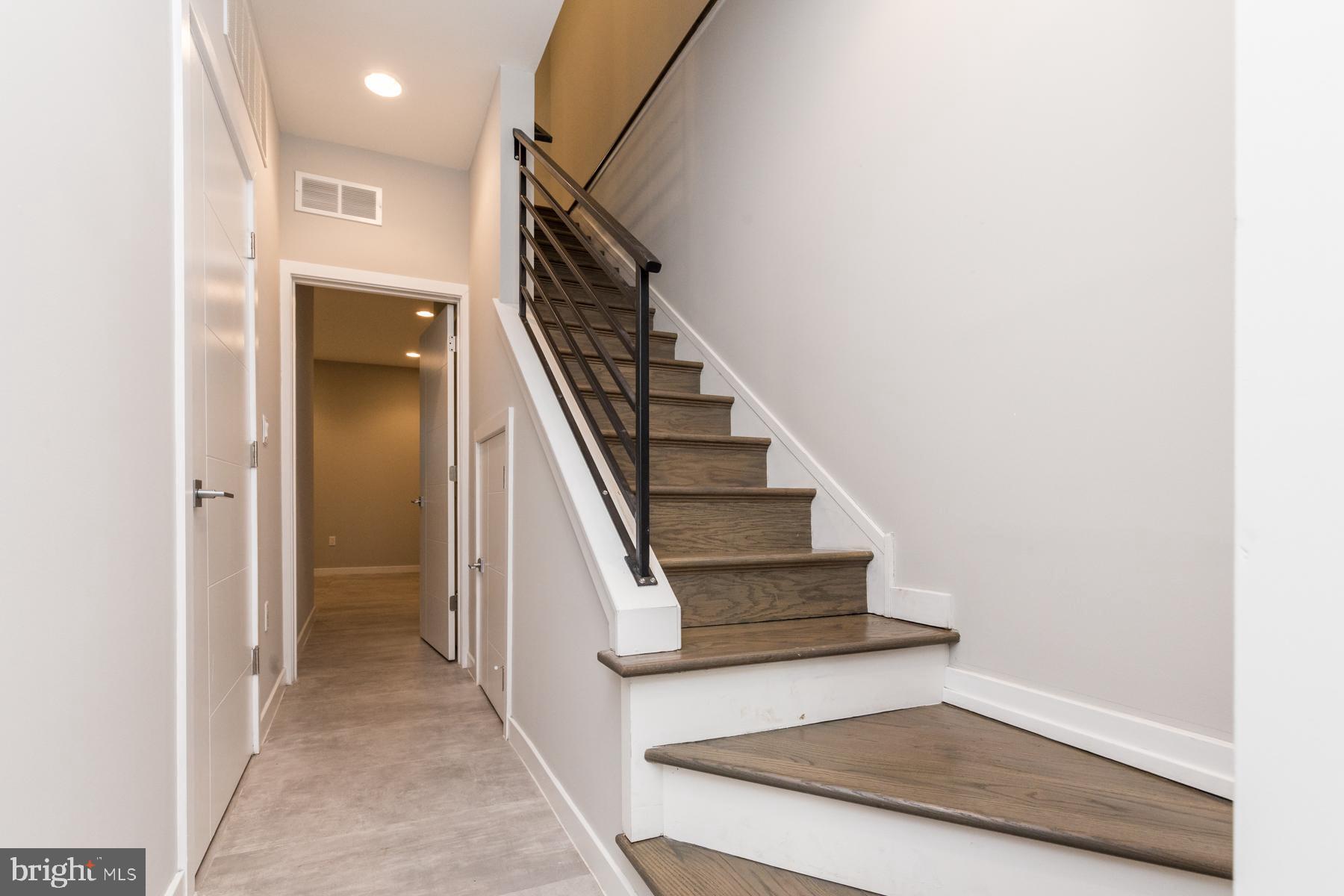 1815 Ranstead Street, Unit 1 Philadelphia, PA 19103 - Photo 14 of 27 a view of entryway and hall with wooden floor