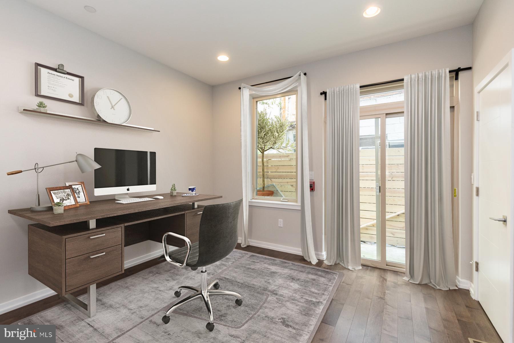 1815 Ranstead Street, Unit 1 Philadelphia, PA 19103 - Photo 2 of 27 a view of a workspace with furniture and a window