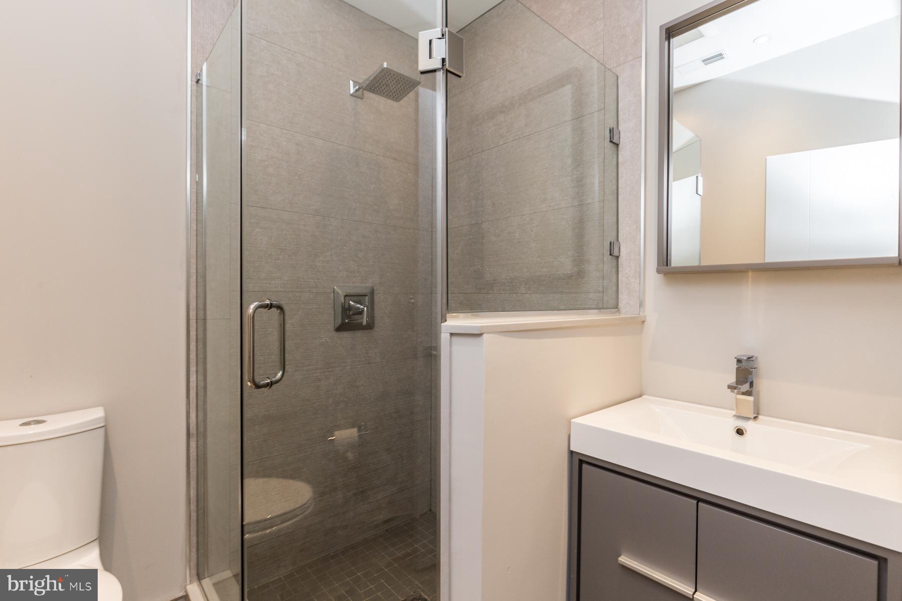 1815 Ranstead Street, Unit 1 Philadelphia, PA 19103 - Photo 22 of 27 a bathroom with a sink toilet and shower