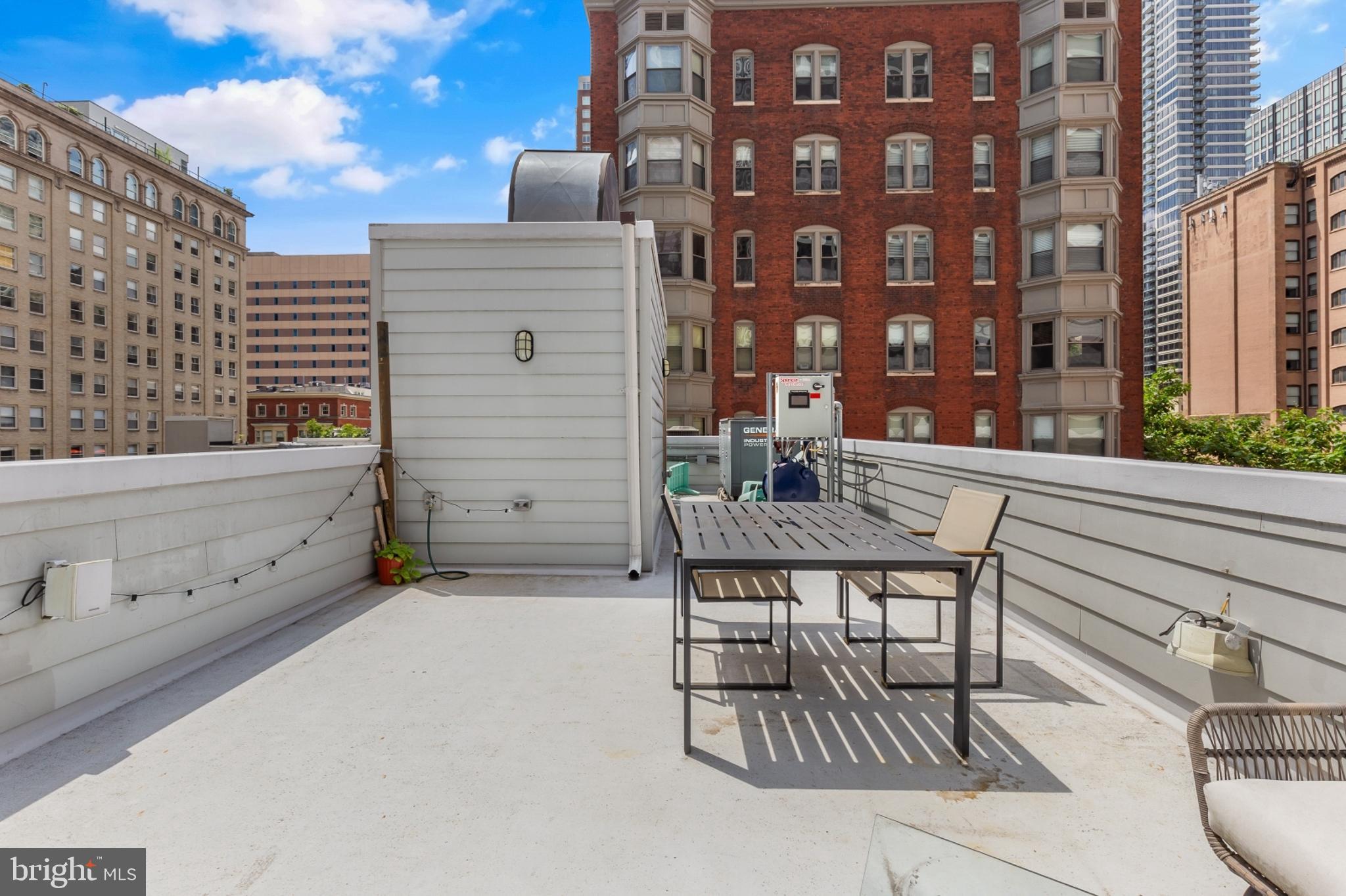 1815 Ranstead Street, Unit 1 Philadelphia, PA 19103 - Photo 24 of 27 a view of a chairs and table in the back yard of the building