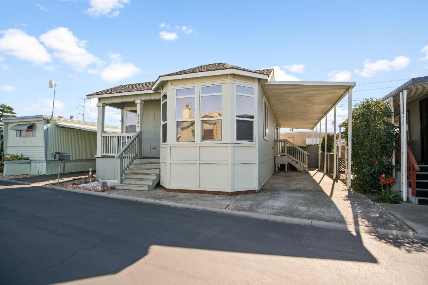 3524 Homestead Way, Unit 57 Ceres, CA 95307 - Photo 1 of 5 a view of a back yard of the house