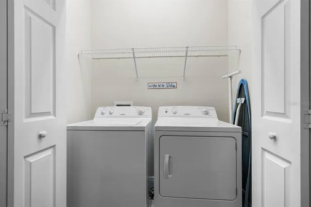 a utility room with dryer and washer