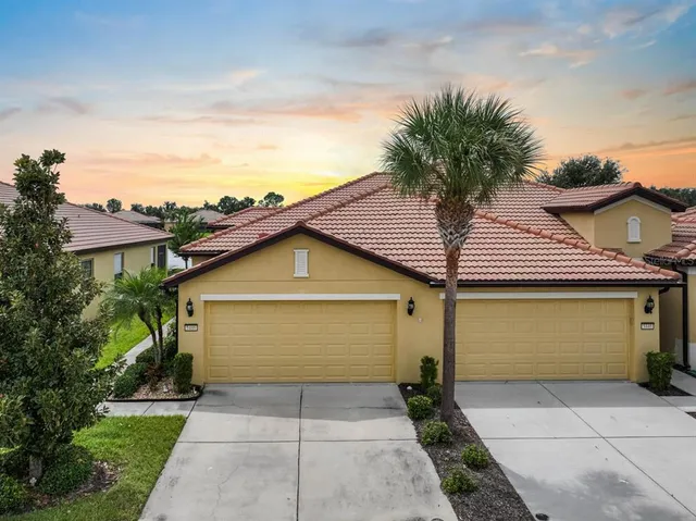 a front view of a house with a garage