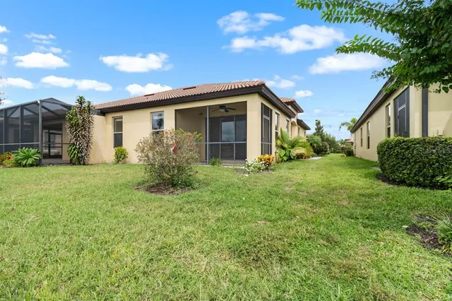 a yellow house with garden in front of it