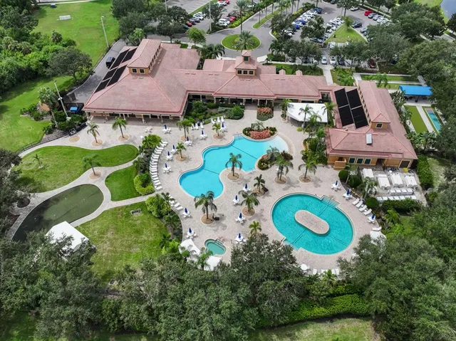 an aerial view of a house with outdoor space