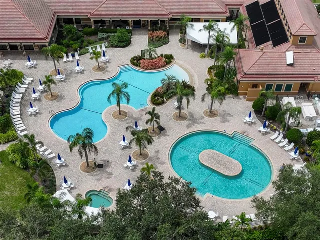 an aerial view of a dinning table and chairs in the patio