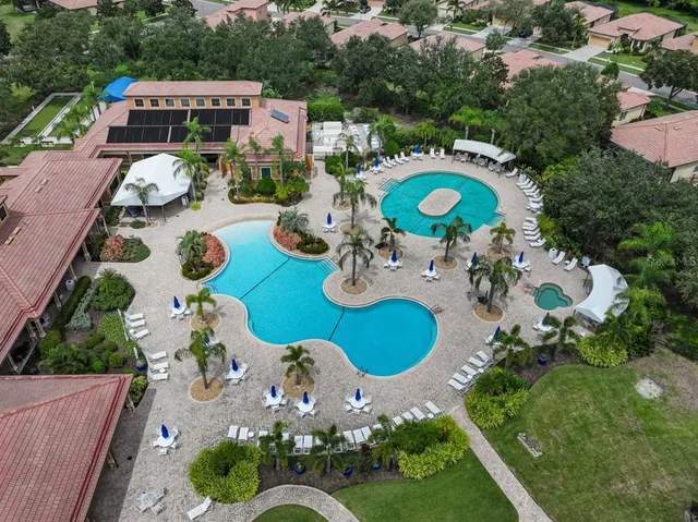 a view of a swimming pool with a patio