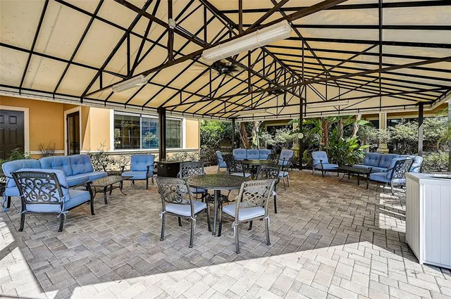 a living room with furniture and book shelf