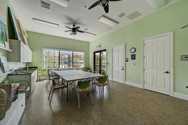 a room with gym equipment and a large window