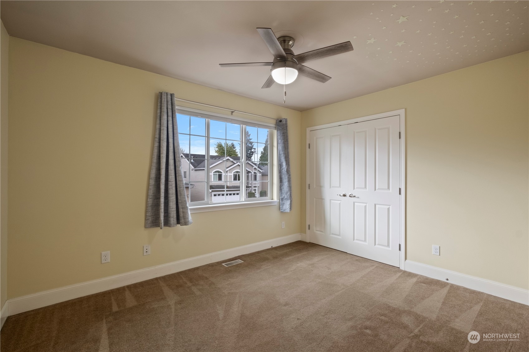8624 South 133rd Place Renton, WA 98178 - Photo 21 of 39 an empty room with windows and fan