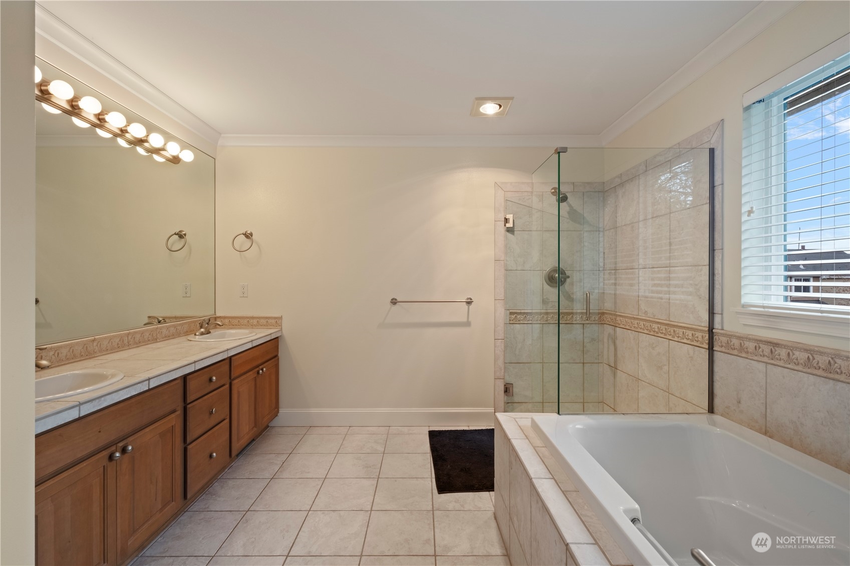 8624 South 133rd Place Renton, WA 98178 - Photo 27 of 39 a spacious bathroom with a tub sink shower and mirror