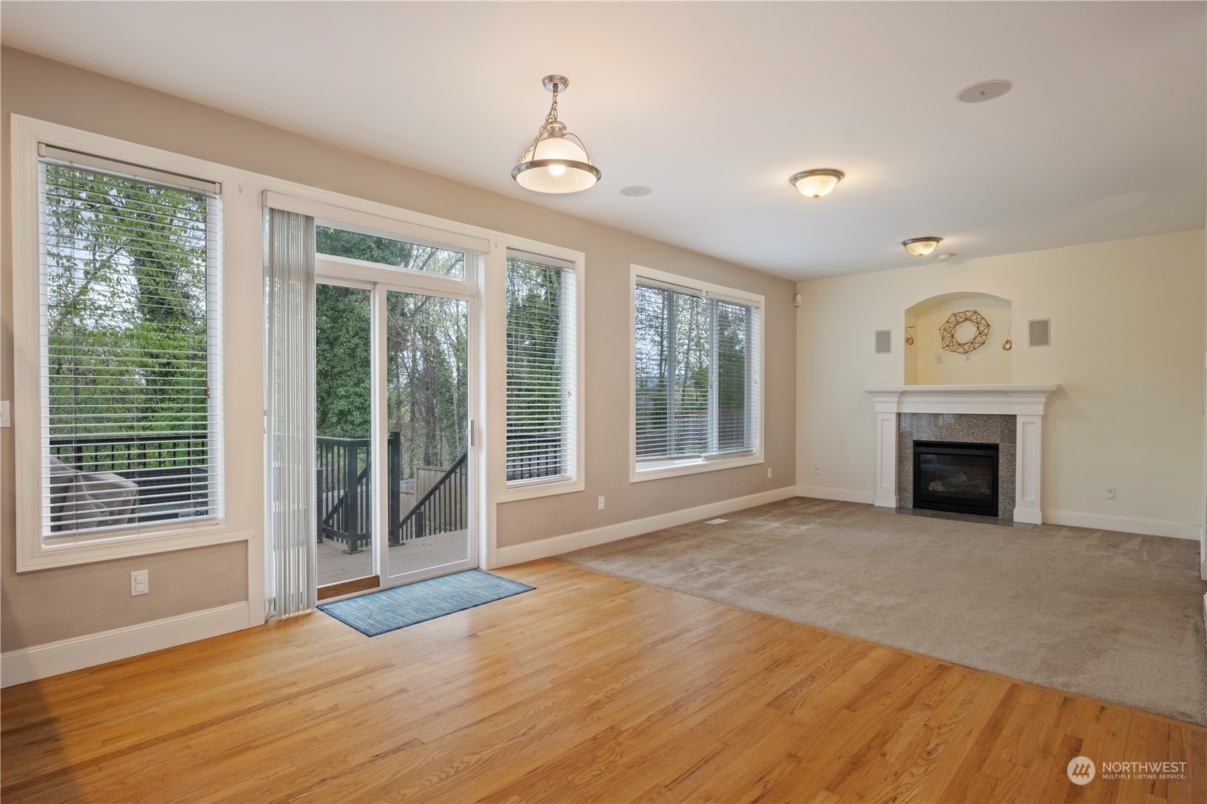 8624 South 133rd Place Renton, WA 98178 - Photo 8 of 39 a view of empty room with wooden floor and fireplace