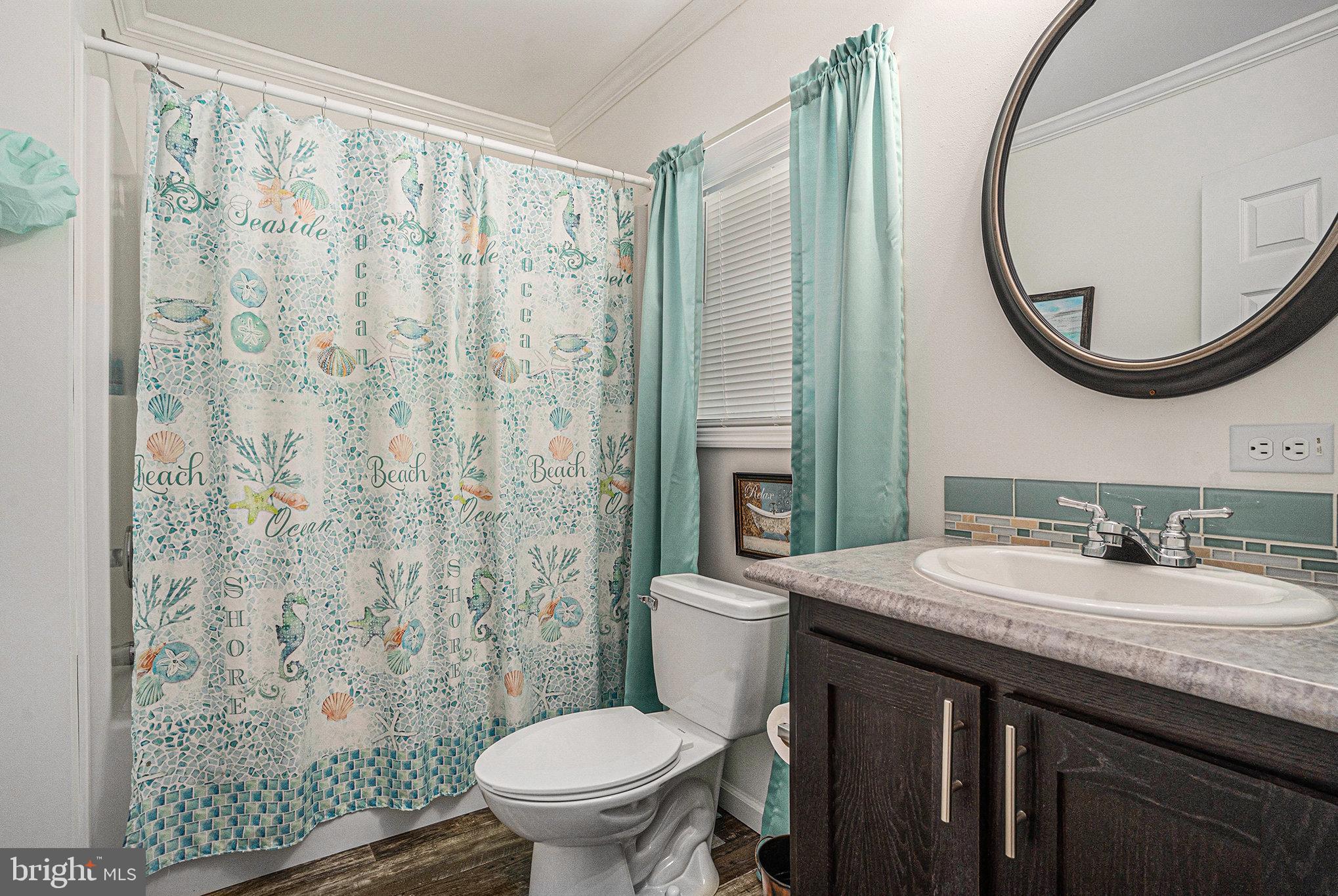 906 Lakeview Drive Green Lane, PA 18054 - Photo 26 of 37 a bathroom with a granite countertop sink mirror vanity and a toilet