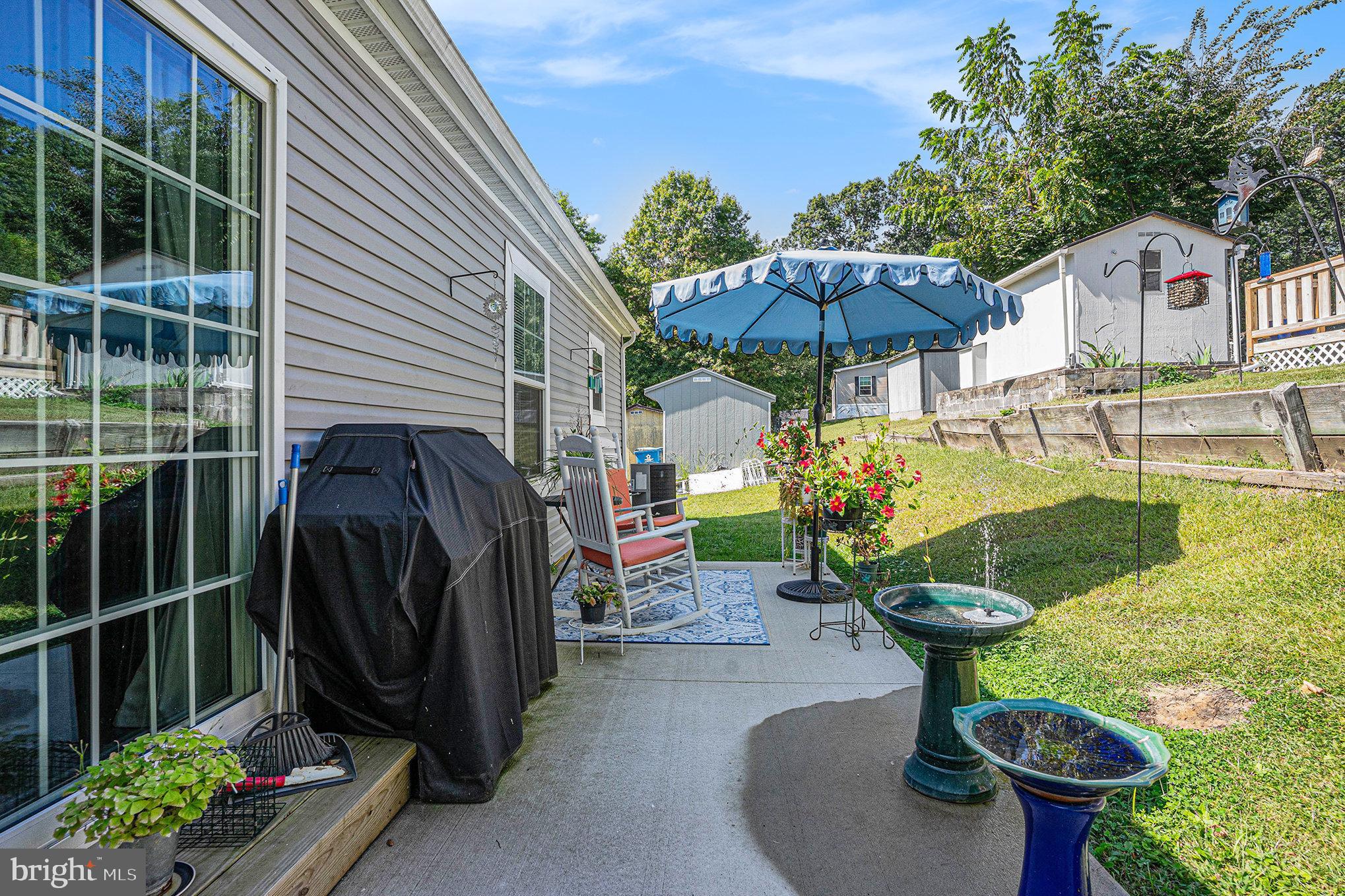 906 Lakeview Drive Green Lane, PA 18054 - Photo 28 of 37 a view of a chair and table in backyard