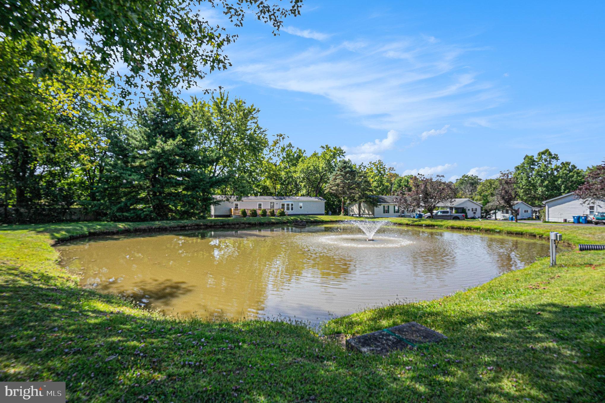 906 Lakeview Drive Green Lane, PA 18054 - Photo 35 of 37 a view of a lake with houses in the background