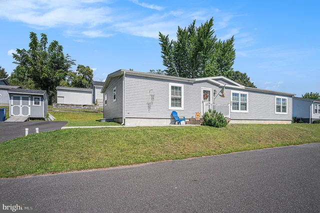 a view of a house with a back yard