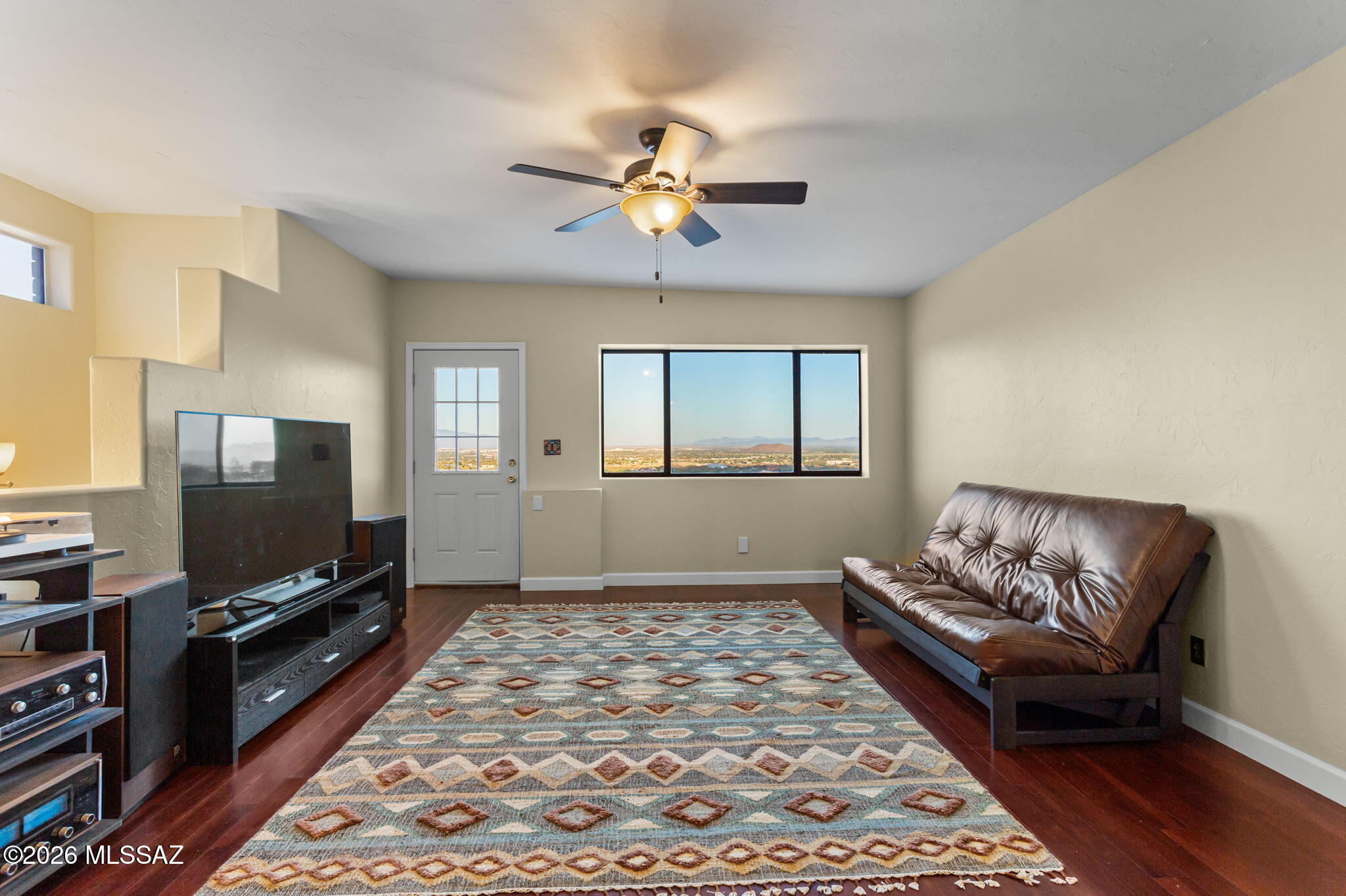4210 West Mossman Road Tucson, AZ 85746 - Photo 17 of 51 a living room with furniture and a flat screen tv