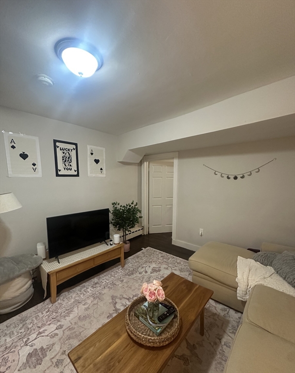 847 Beacon Street, Unit 9 Boston, MA 02215 - Photo 5 of 10 a living room with furniture and a rug
