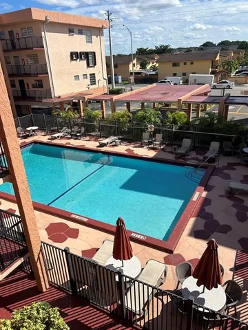 a view of a swimming pool with a patio