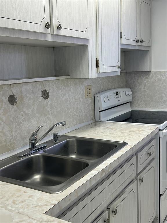 1855 West 60th Street, Unit 325 Hialeah, FL 33012 - Photo 13 of 18 a view with a sink and cabinets