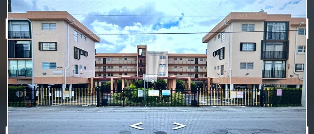 1855 West 60th Street, Unit 325 Hialeah, FL 33012 - Photo 17 of 18 a front view of a building with a garden